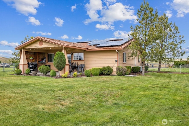 237 Reeds Rd, Touchet, WA 99360 - back of property featuring solar panels and a tiled roof