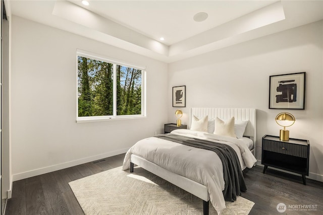11210 SE 74th St, Newcastle, WA 98056 - bedroom featuring a raised ceiling, baseboards, dark wood-style floors, and recessed lighting