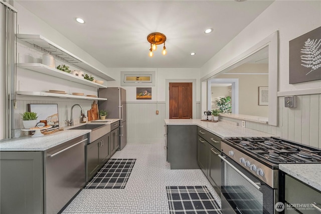 803 N 2nd St, Tacoma, WA 98403 - kitchen featuring stainless steel appliances, open shelves, a sink, light stone countertops, and gray cabinetry
