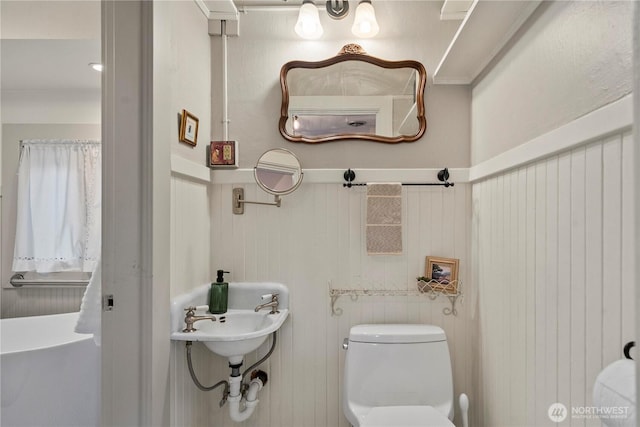 803 N 2nd St, Tacoma, WA 98403 - bathroom with toilet, wainscoting, and a sink