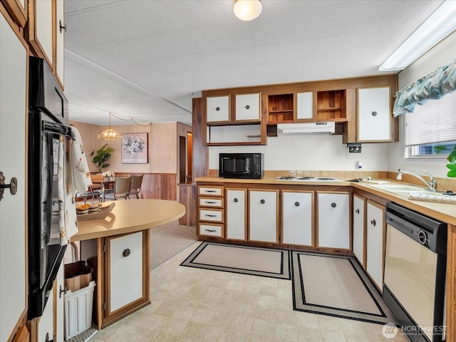 1415 84th St SE Unit 159, Everett, WA 98208 - kitchen with dishwasher, black microwave, light countertops, a sink, and under cabinet range hood