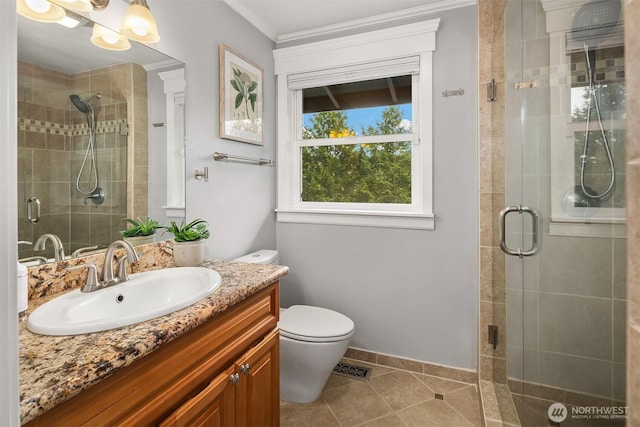 13050 SE 21st Pl, Bellevue, WA 98005 - full bath with a shower stall, ornamental molding, vanity, tile patterned floors, and toilet