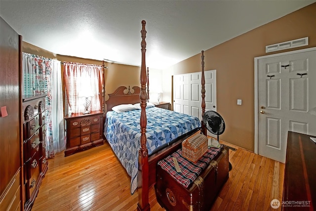 19308 8th St E, Spanaway, WA 09387 - bedroom featuring light wood-style flooring, vaulted ceiling, and a closet