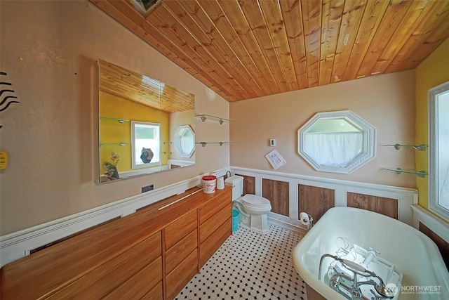 19308 8th St E, Spanaway, WA 09387 - bathroom with a freestanding bath, wood ceiling, vaulted ceiling, and vanity