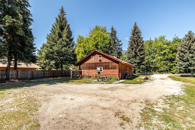 view of property exterior with fence