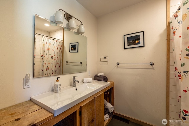 bathroom featuring vanity and a shower with curtain