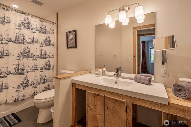 full bath with toilet, vanity, and shower / bath combination with curtain