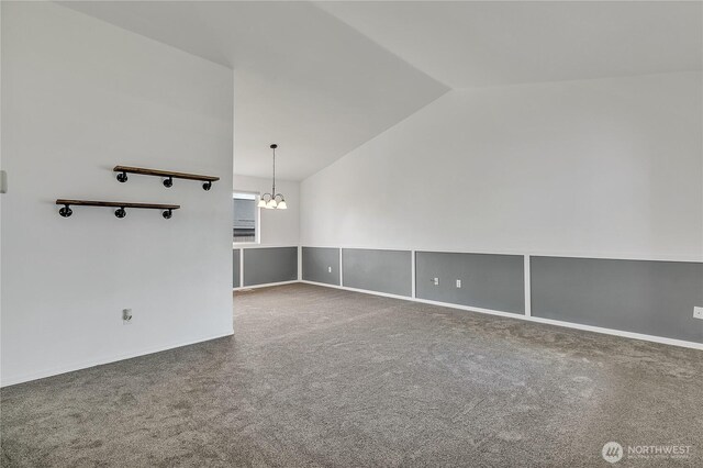 1108 200th Street Ct E, Spanaway, WA 98387 - spare room featuring lofted ceiling, a chandelier, and carpet