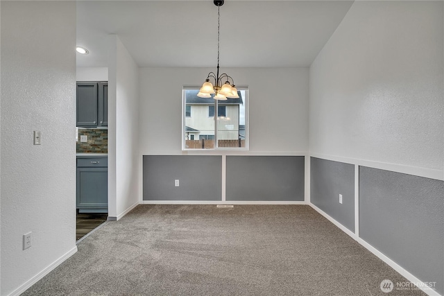 1108 200th Street Ct E, Spanaway, WA 98387 - spare room featuring a chandelier, carpet floors, baseboards, and a textured wall