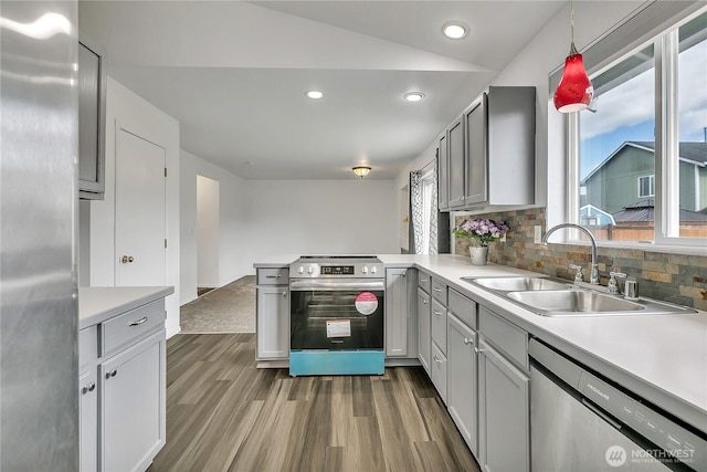 1108 200th Street Ct E, Spanaway, WA 98387 - kitchen featuring stainless steel appliances, a sink, dark wood-type flooring, light countertops, and recessed lighting