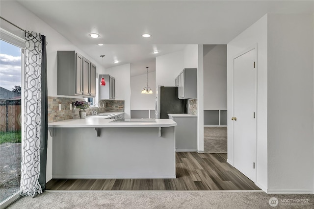 1108 200th Street Ct E, Spanaway, WA 98387 - kitchen featuring gray cabinetry, freestanding refrigerator, dark wood-style floors, and a peninsula