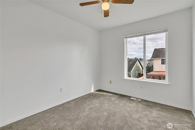 1108 200th Street Ct E, Spanaway, WA 98387 - spare room featuring carpet floors, ceiling fan, and baseboards