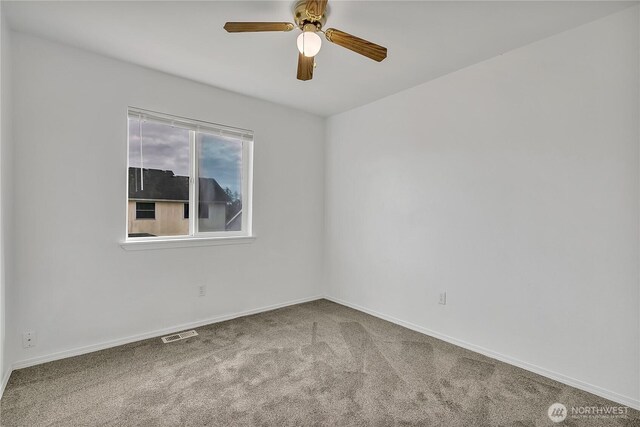 1108 200th Street Ct E, Spanaway, WA 98387 - unfurnished room featuring carpet flooring, baseboards, and ceiling fan
