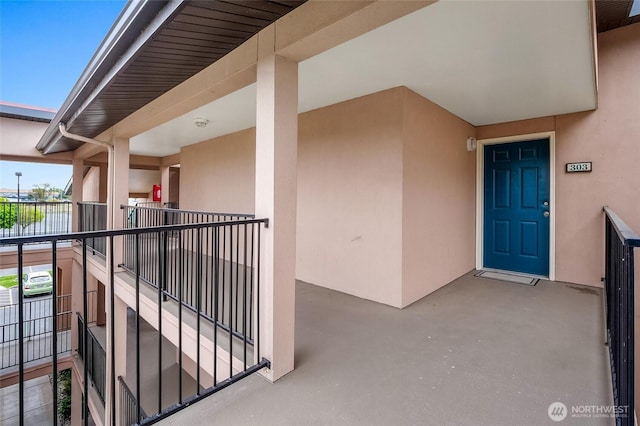 2900 W Marina Dr Unit 303, Moses Lake, WA 98837 - view of exterior entry with stucco siding and a balcony