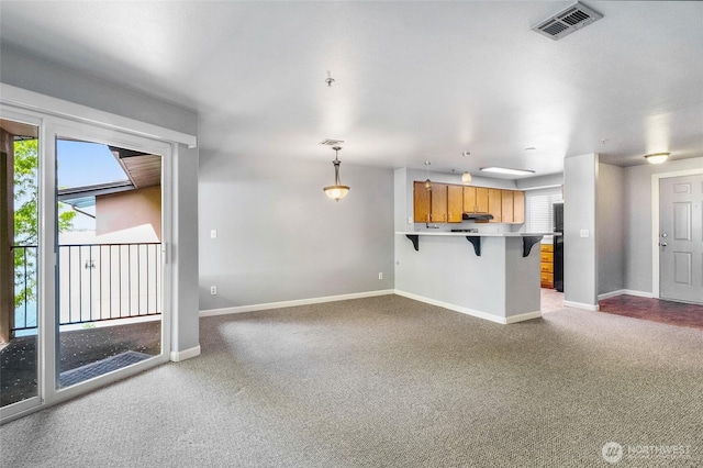 2900 W Marina Dr Unit 303, Moses Lake, WA 98837 - unfurnished living room featuring carpet flooring and baseboards