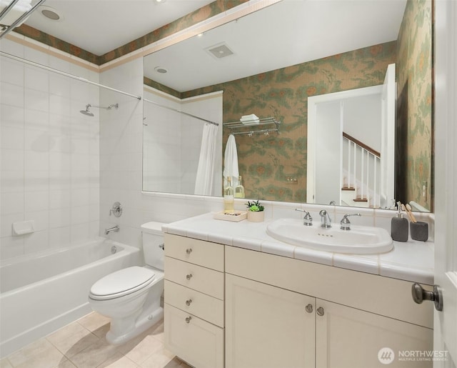 bathroom with wallpapered walls, toilet, shower / tub combo with curtain, tile patterned floors, and vanity