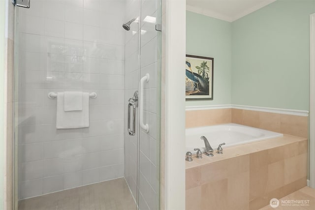 full bath featuring a shower stall, a garden tub, and tile patterned floors