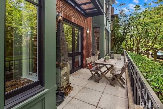 balcony featuring outdoor dining space and a patio area