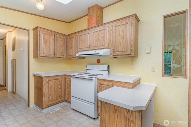kitchen with white range with electric stovetop, under cabinet range hood, light countertops, crown molding, and a peninsula