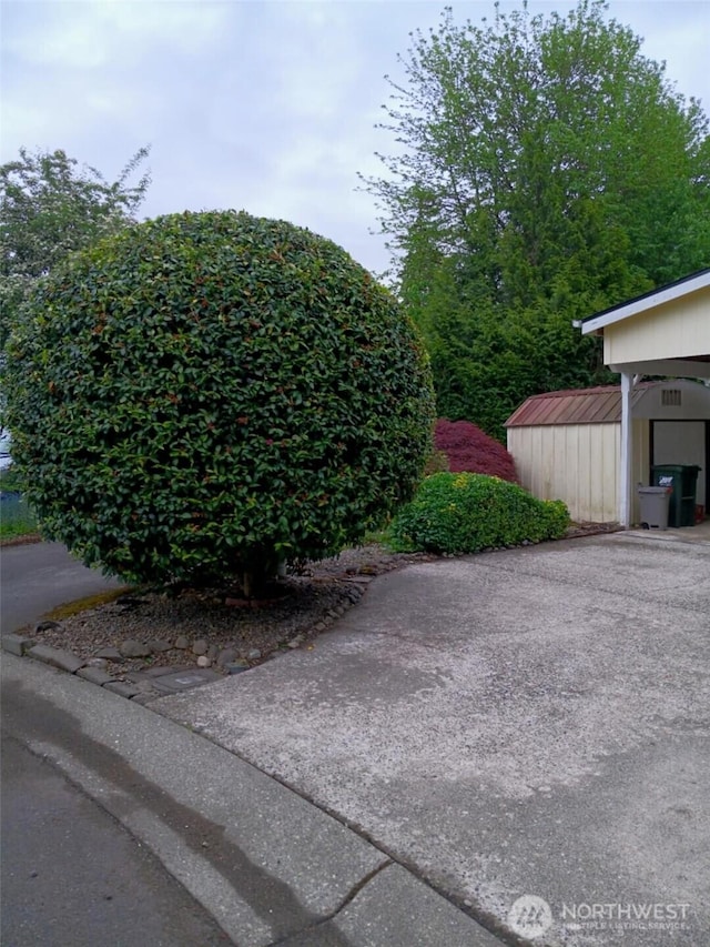 exterior space with a storage shed