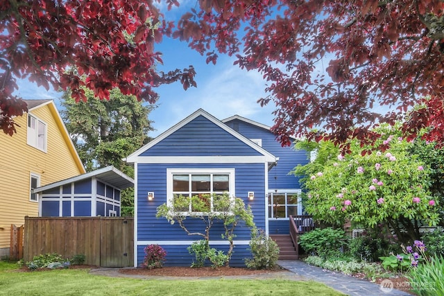 view of front of property with a wooden deck