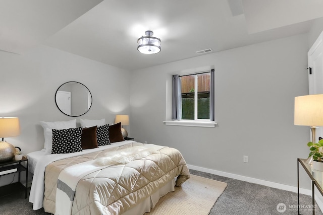 carpeted bedroom featuring baseboards