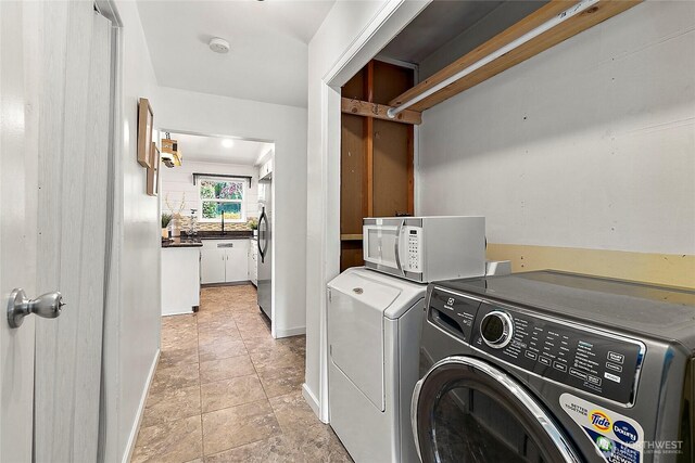 laundry room featuring separate washer and dryer