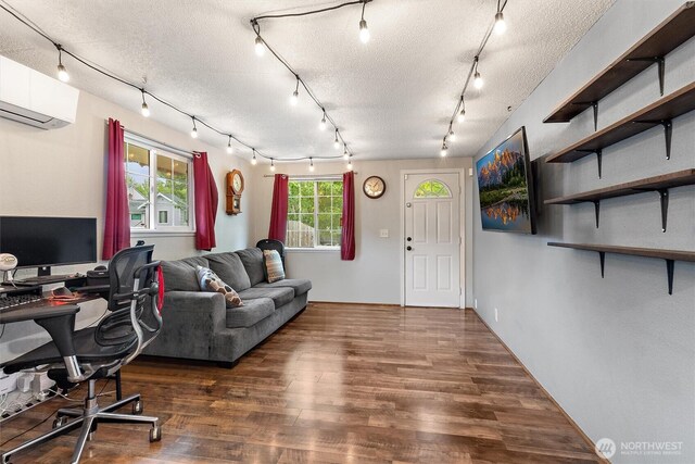 714 S 43rd St, Tacoma, WA 98418 - office area with track lighting, a wall unit AC, wood finished floors, and a textured ceiling