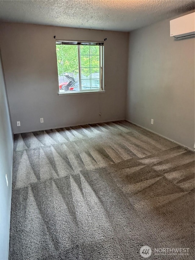 714 S 43rd St, Tacoma, WA 98418 - carpeted empty room featuring an AC wall unit and a textured ceiling