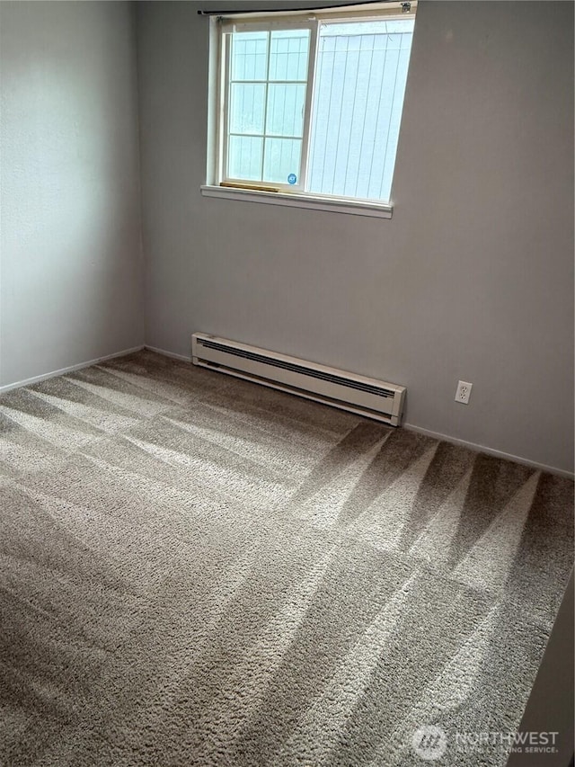 714 S 43rd St, Tacoma, WA 98418 - carpeted empty room featuring a baseboard radiator and baseboards