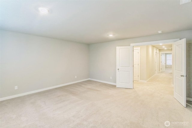 unfurnished room featuring baseboards, light colored carpet, and recessed lighting