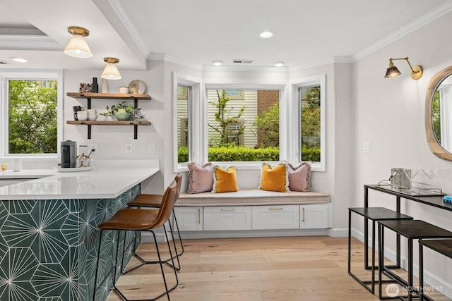 725 1st St S Unit 104, Kirkland, WA 98033 - bar area with crown molding, light wood finished floors, recessed lighting, and baseboards