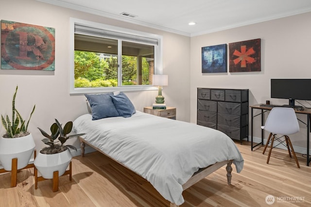 725 1st St S Unit 104, Kirkland, WA 98033 - bedroom with wood finished floors, ornamental molding, recessed lighting, and a desk