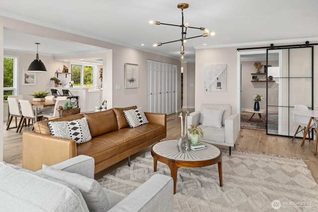 725 1st St S Unit 104, Kirkland, WA 98033 - living room featuring wood finished floors, a chandelier, crown molding, and baseboards