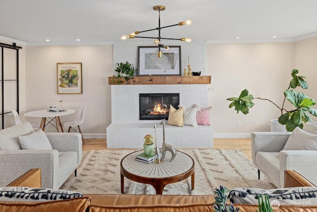725 1st St S Unit 104, Kirkland, WA 98033 - living room with wood finished floors, crown molding, recessed lighting, baseboards, and a fireplace