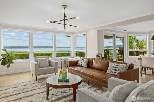 725 1st St S Unit 104, Kirkland, WA 98033 - sunroom / solarium with a chandelier, a water view, and healthy amount of natural light