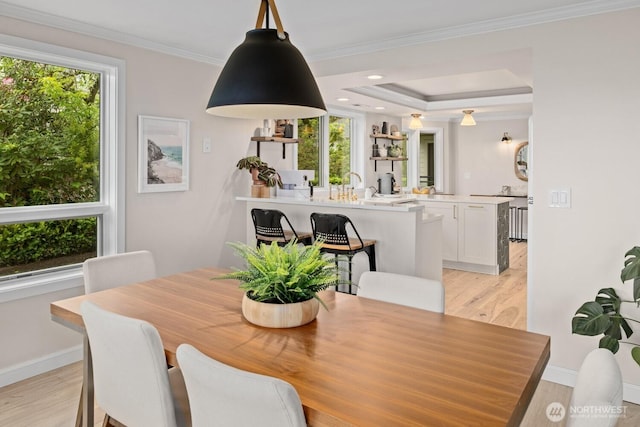 725 1st St S Unit 104, Kirkland, WA 98033 - dining space featuring light wood-type flooring, baseboards, crown molding, and recessed lighting