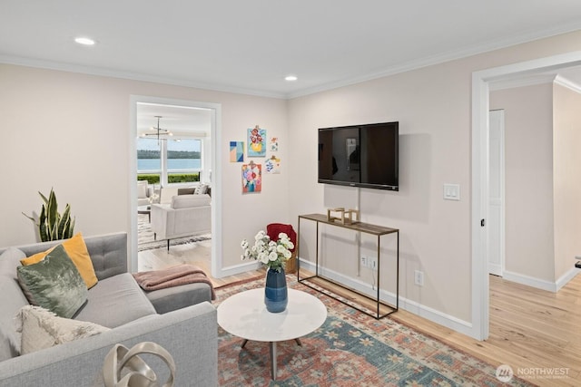 725 1st St S Unit 104, Kirkland, WA 98033 - living area with wood finished floors, crown molding, baseboards, and recessed lighting