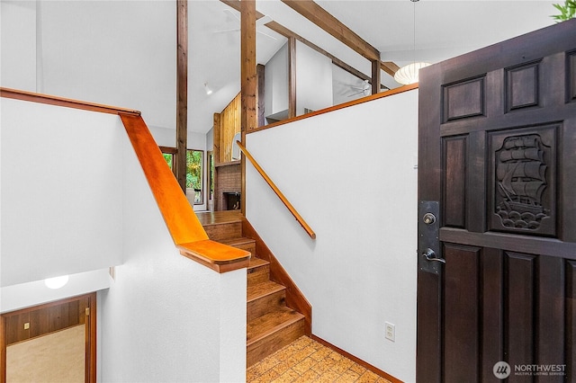 5471 NE Foster Rd, Bainbridge Island, WA 98110 - entryway with stairway, baseboards, and high vaulted ceiling