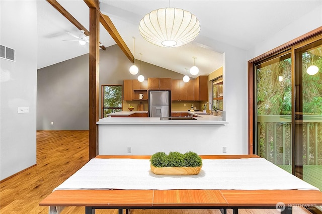 5471 NE Foster Rd, Bainbridge Island, WA 98110 - dining space featuring light wood finished floors, healthy amount of natural light, and a ceiling fan