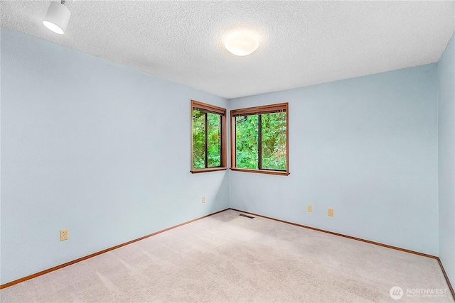 5471 NE Foster Rd, Bainbridge Island, WA 98110 - empty room with carpet flooring, a textured ceiling, and baseboards