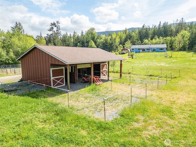 399 Pike Pl, Sequim, WA 98382 - view of outbuilding featuring an exterior structure, an outbuilding, and a forest view