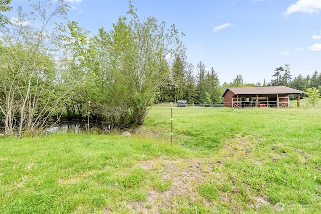 399 Pike Pl, Sequim, WA 98382 - view of yard featuring fence, an outbuilding, and a pole building