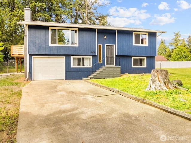 5431 Anton Ct SE, Olympia, WA 98501 - raised ranch featuring concrete driveway and a chimney