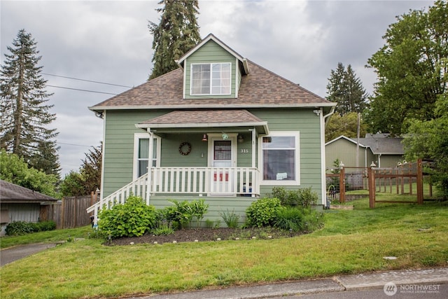 view of front of property featuring a porch and roof with shingles