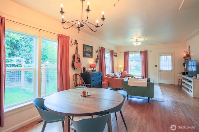 315 SW C St, Tumwater, WA 98512 - dining area featuring a chandelier, wood-type flooring, and baseboards