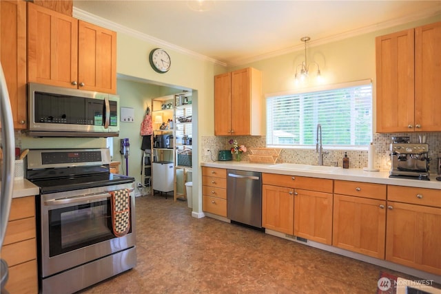 315 SW C St, Tumwater, WA 98512 - kitchen featuring appliances with stainless steel finishes, a sink, tasteful backsplash, tile patterned floors, and crown molding