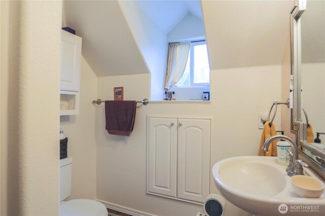 315 SW C St, Tumwater, WA 98512 - bathroom featuring vaulted ceiling, a sink, and toilet