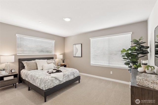 16723 Alderwood Mall Pkwy Unit E2, Lynnwood, WA 98037 - bedroom with light colored carpet, baseboards, and multiple windows