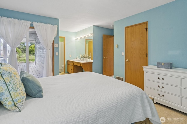 575 Kahkwo Ct SE, Ocean Shores, WA 98569 - bedroom with access to outside and ensuite bathroom